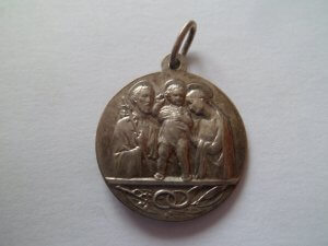 Medaille achterzijde - Pius XII Pontifex Maximus toont de heilige familie
